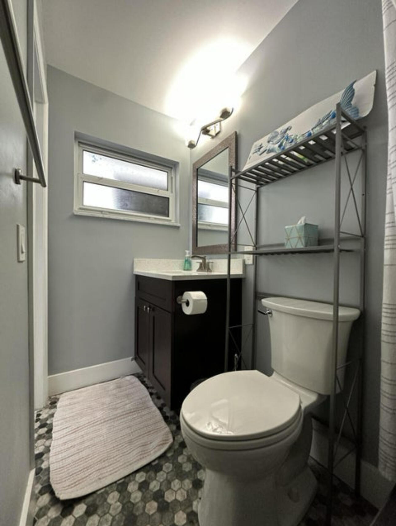 270 Northwest 36th Street Boca Raton, FL 33431 - Photo 71 of 82 a bathroom with a toilet and a mirror