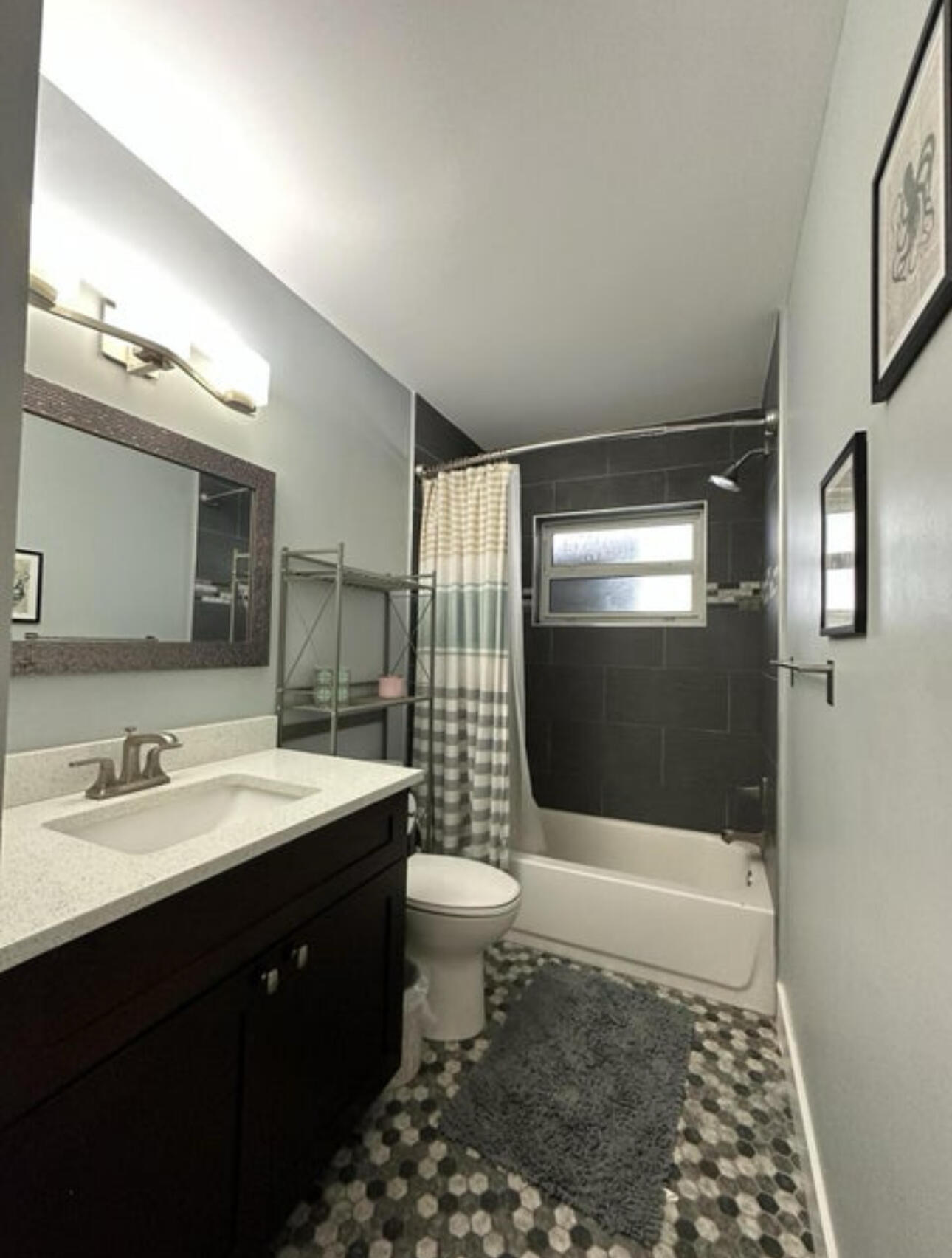 270 Northwest 36th Street Boca Raton, FL 33431 - Photo 76 of 82 a bathroom with a sink a toilet a mirror and shower