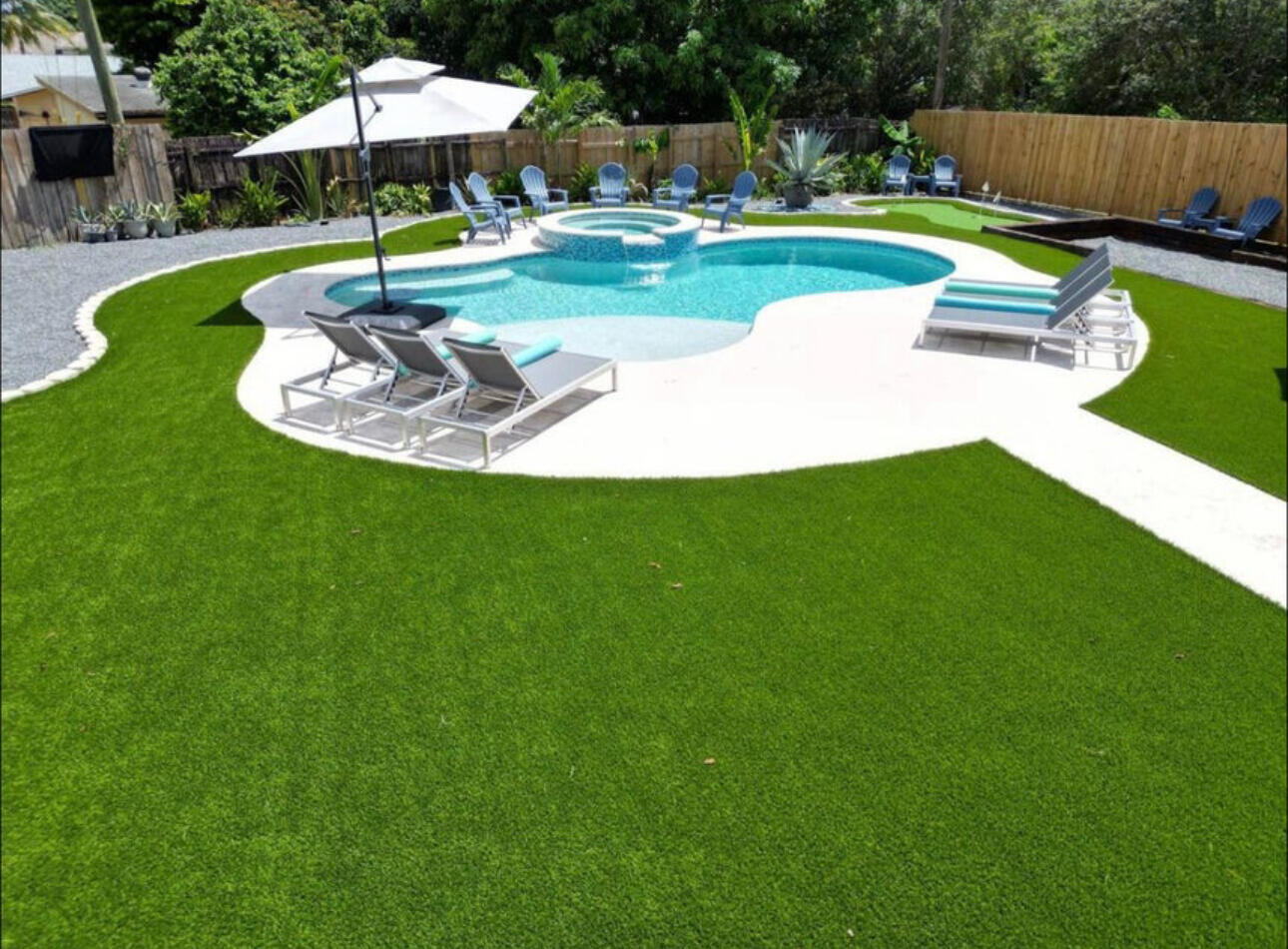 270 Northwest 36th Street Boca Raton, FL 33431 - Photo 8 of 82 a swimming pool with lots of tress in front of it