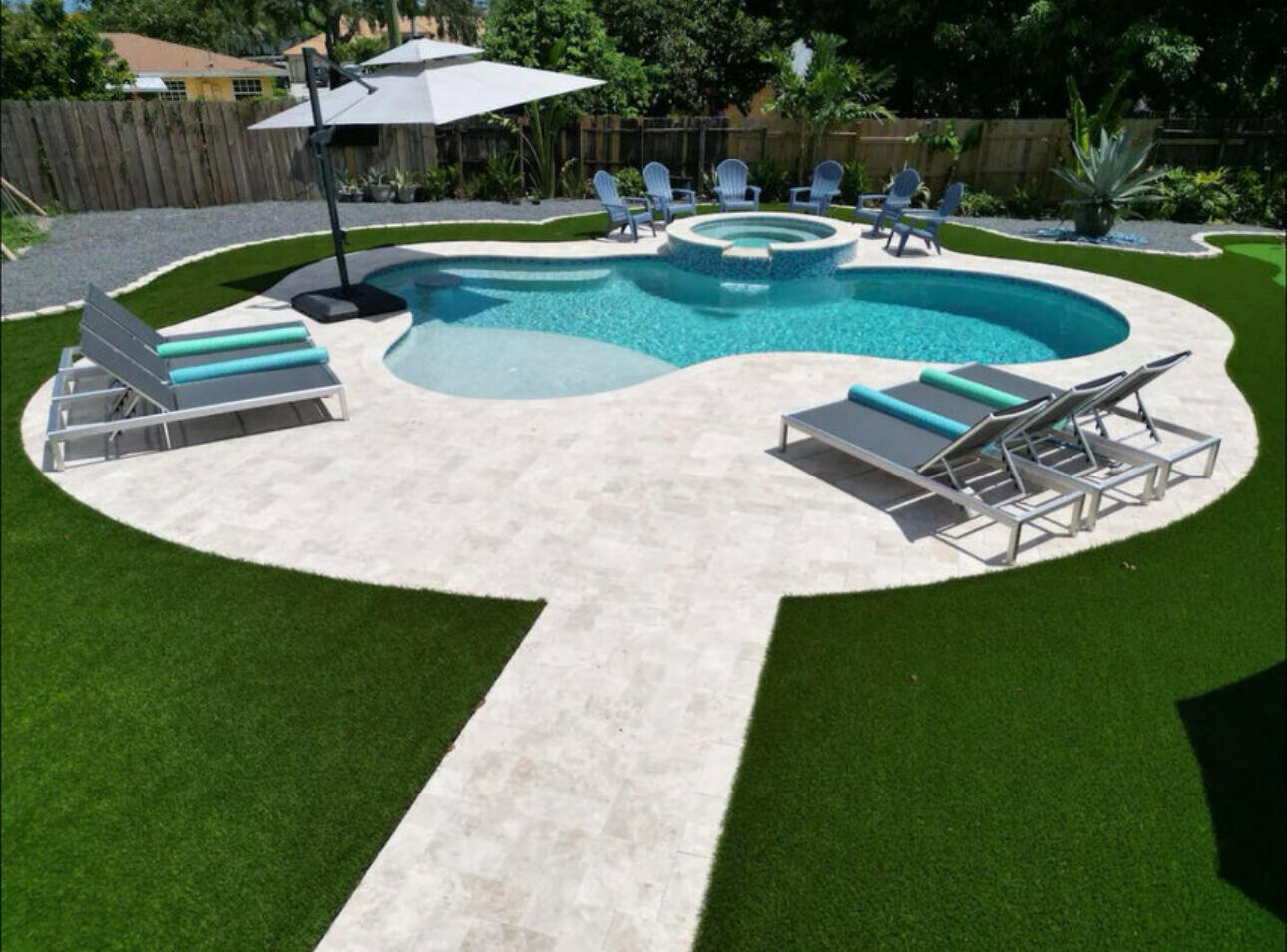 270 Northwest 36th Street Boca Raton, FL 33431 - Photo 9 of 82 a swimming pool with outdoor seating and yard