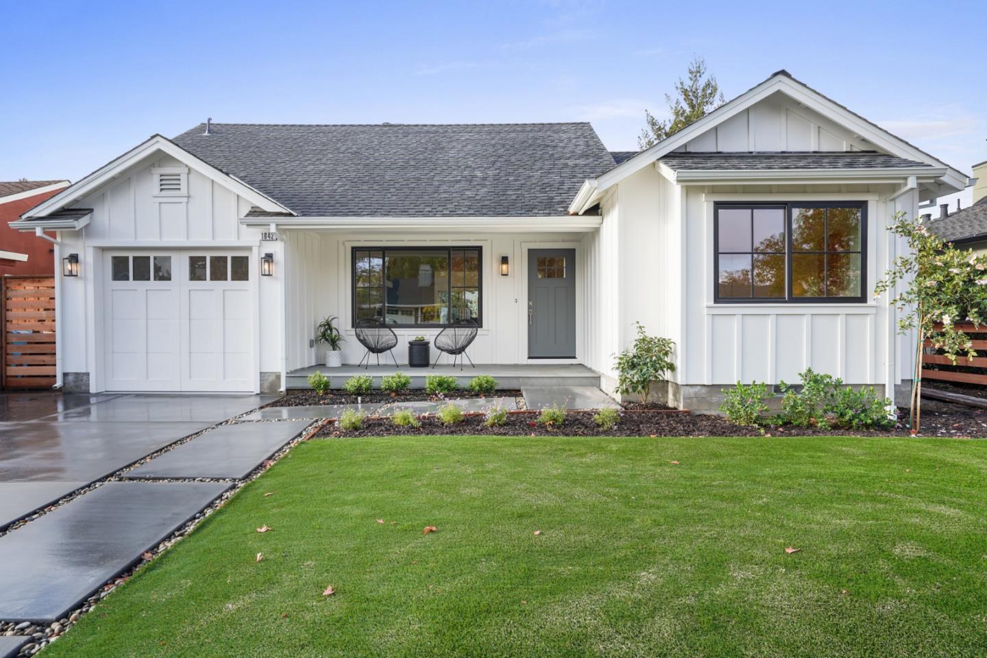 1642 Anamor Street Redwood City, CA 94061 - Photo 1 of 19 a front view of a house with a yard and potted plants