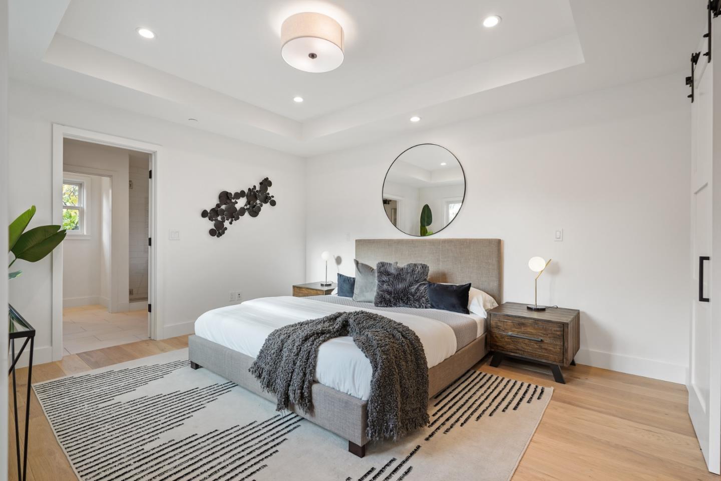 1642 Anamor Street Redwood City, CA 94061 - Photo 13 of 19 a bedroom with a bed and a chandelier