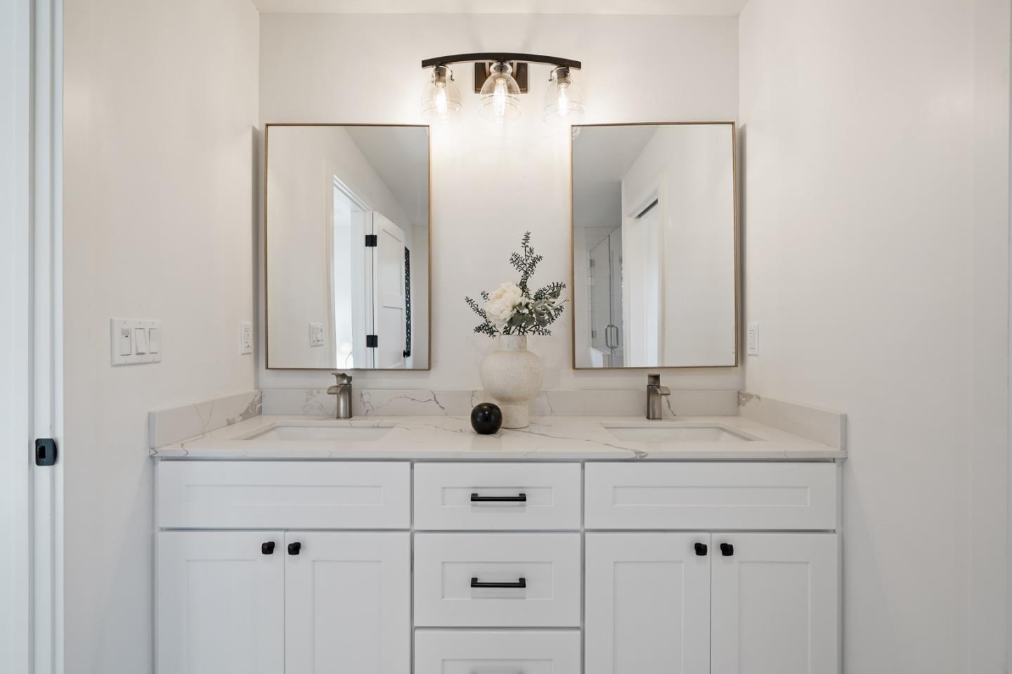 1642 Anamor Street Redwood City, CA 94061 - Photo 15 of 19 a bathroom with double vanity sinks and a mirror