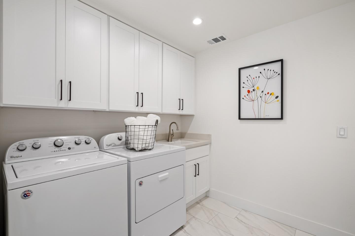 1642 Anamor Street Redwood City, CA 94061 - Photo 7 of 19 a view of cabinets with washer and dryer