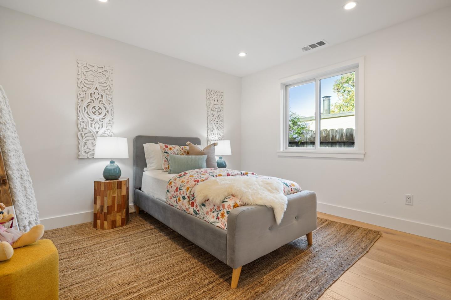 1642 Anamor Street Redwood City, CA 94061 - Photo 10 of 19 a large bedroom with a bed and window