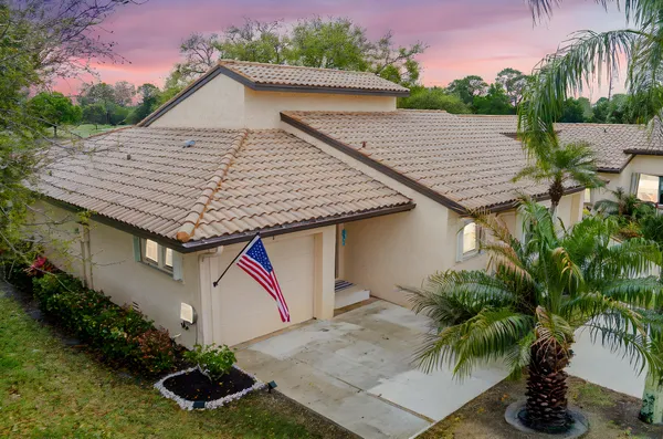 a aerial view of a house and a yard