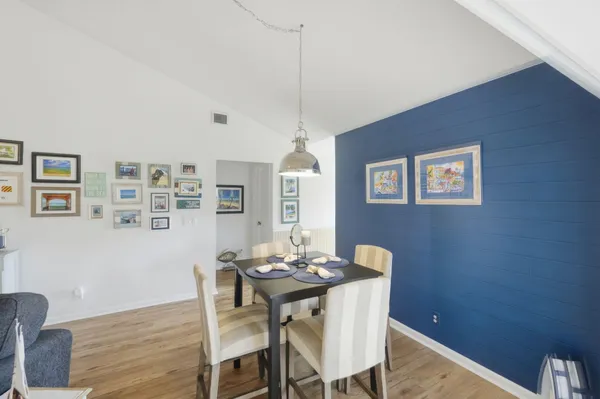 a dining room with furniture and window