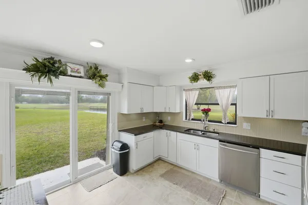 a kitchen with a sink and a refrigerator