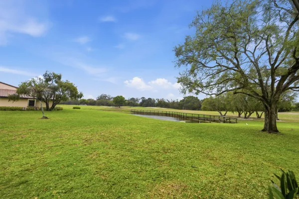 a view of a golf course with a lake
