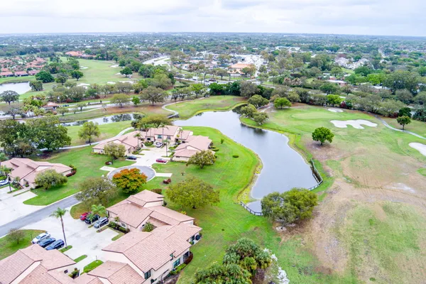 an aerial view of a residential houses with outdoor space