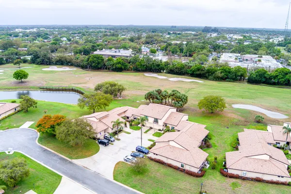 an aerial view of a house with outdoor space