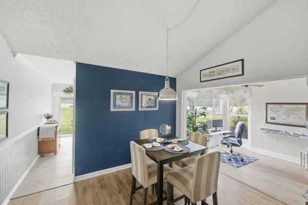 a view of a livingroom with furniture window and wooden floor