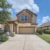 a front view of a house with yard