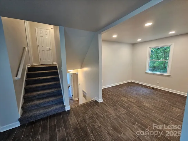an entryway in a hall with a window