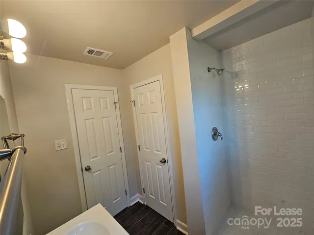 a bathroom with a sink and mirror