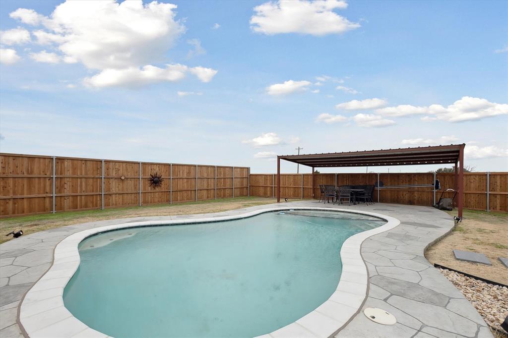 20260 Willow Glade Circle Pilot Point, TX 76258 - Photo 1 of 37 View of swimming pool with a patio area