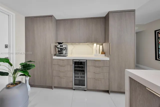 a room with cabinets and a potted plant