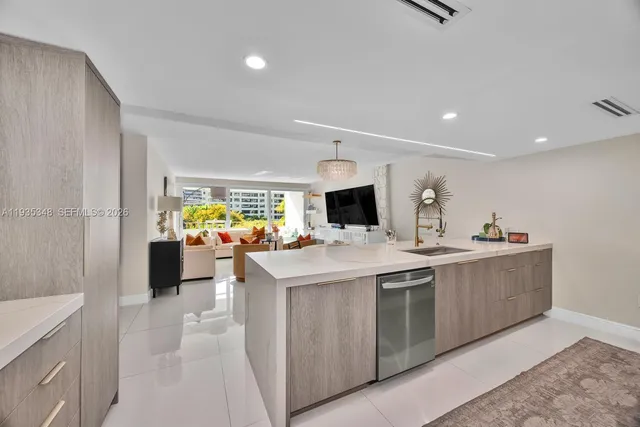 a kitchen with a sink and counter top space