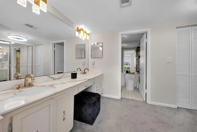 a bathroom with a sink double vanity and a mirror