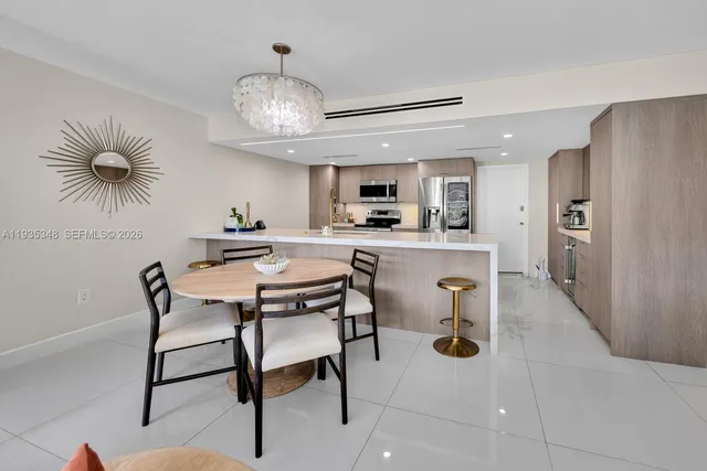 a view of dining room and chandelier fan