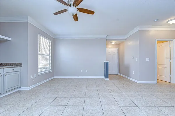 a view of a kitchen with a refrigerator and a sink
