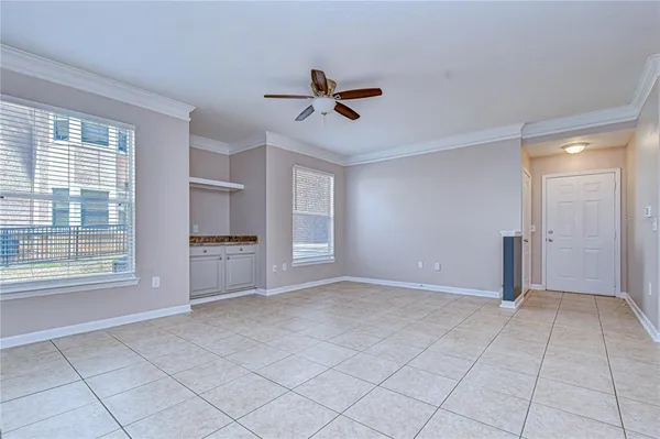 a view of a kitchen with a sink and cabinets