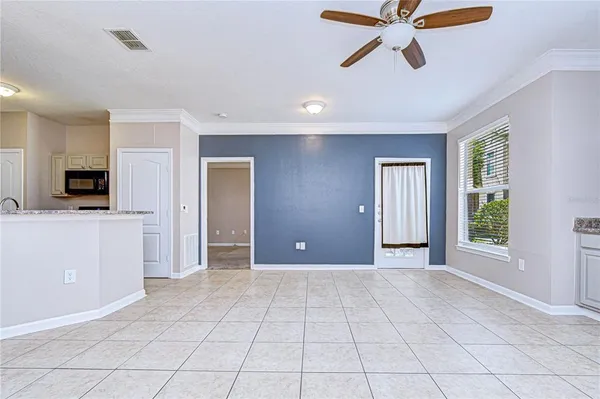 a kitchen with kitchen island cabinets and refrigerator