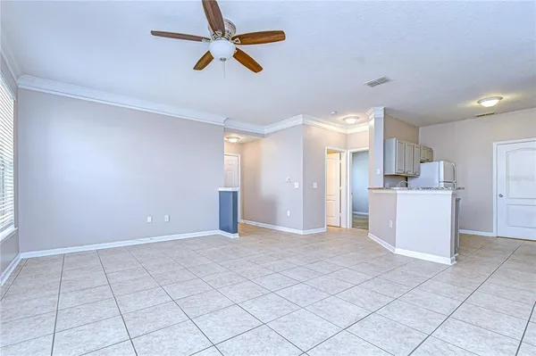 a kitchen with cabinets stainless steel appliances and a counter space