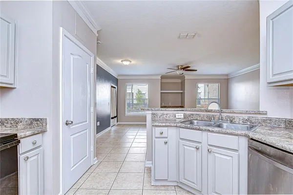 a bathroom with a sink toilet tub and shower
