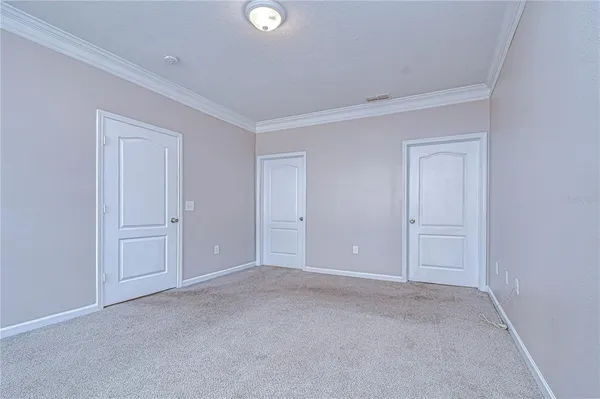 en empty room with large windows