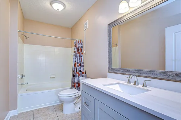 an empty room with a empty space and windows