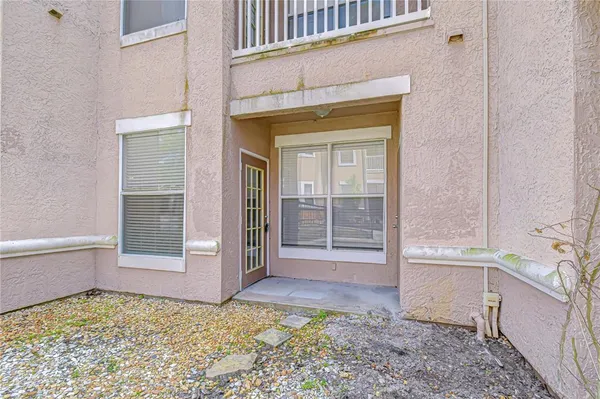 a swimming pool with outdoor seating and yard