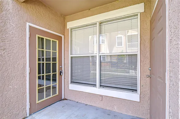 a view of a swimming pool with an outdoor seating