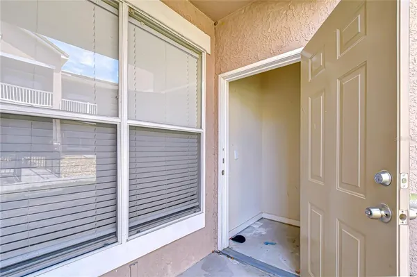 a view of a lake with houses in the back