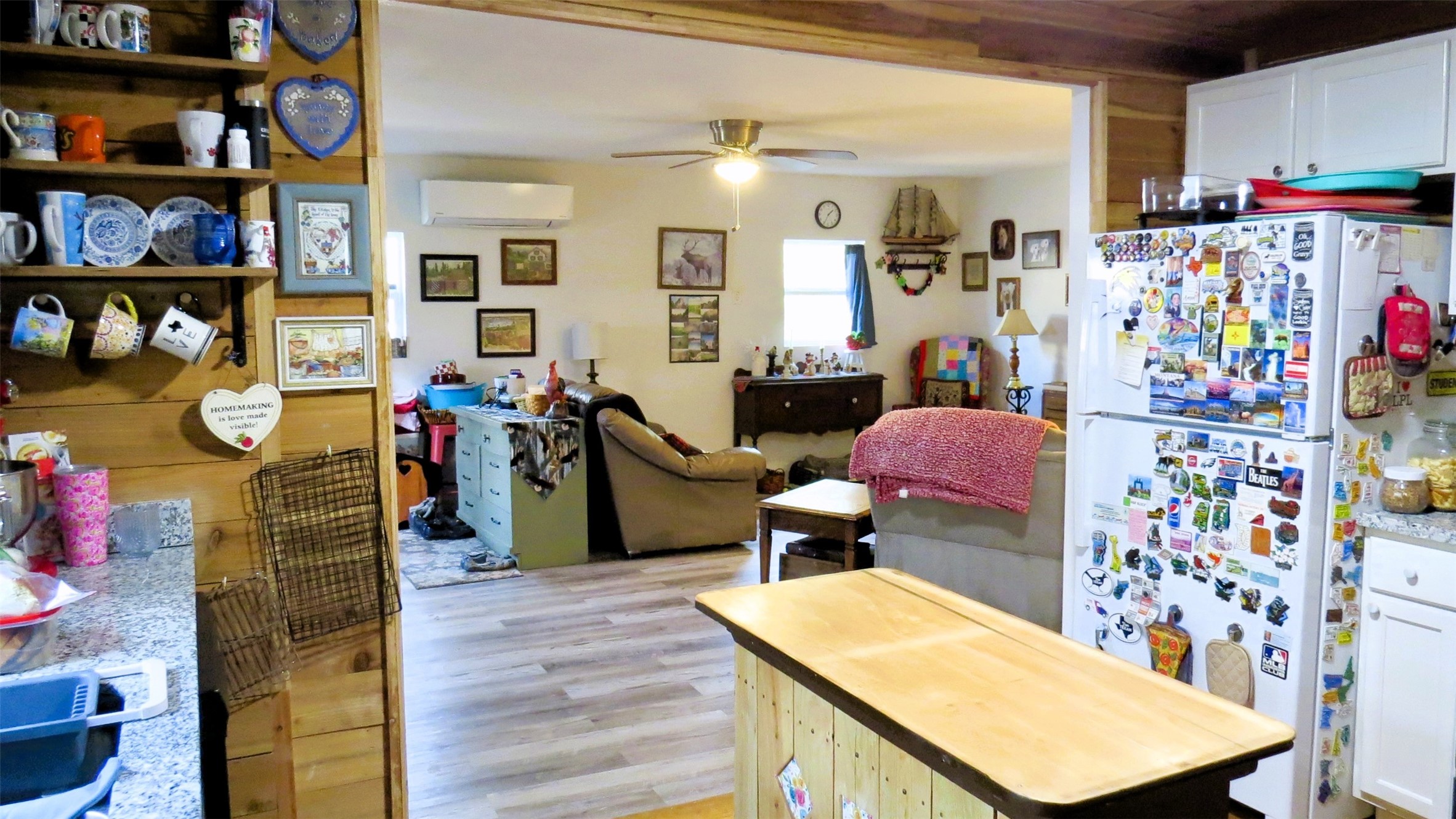 458 Rain Forest Road Onalaska, TX 77360 - Photo 17 of 35 a room with furniture a rug and a bookshelf