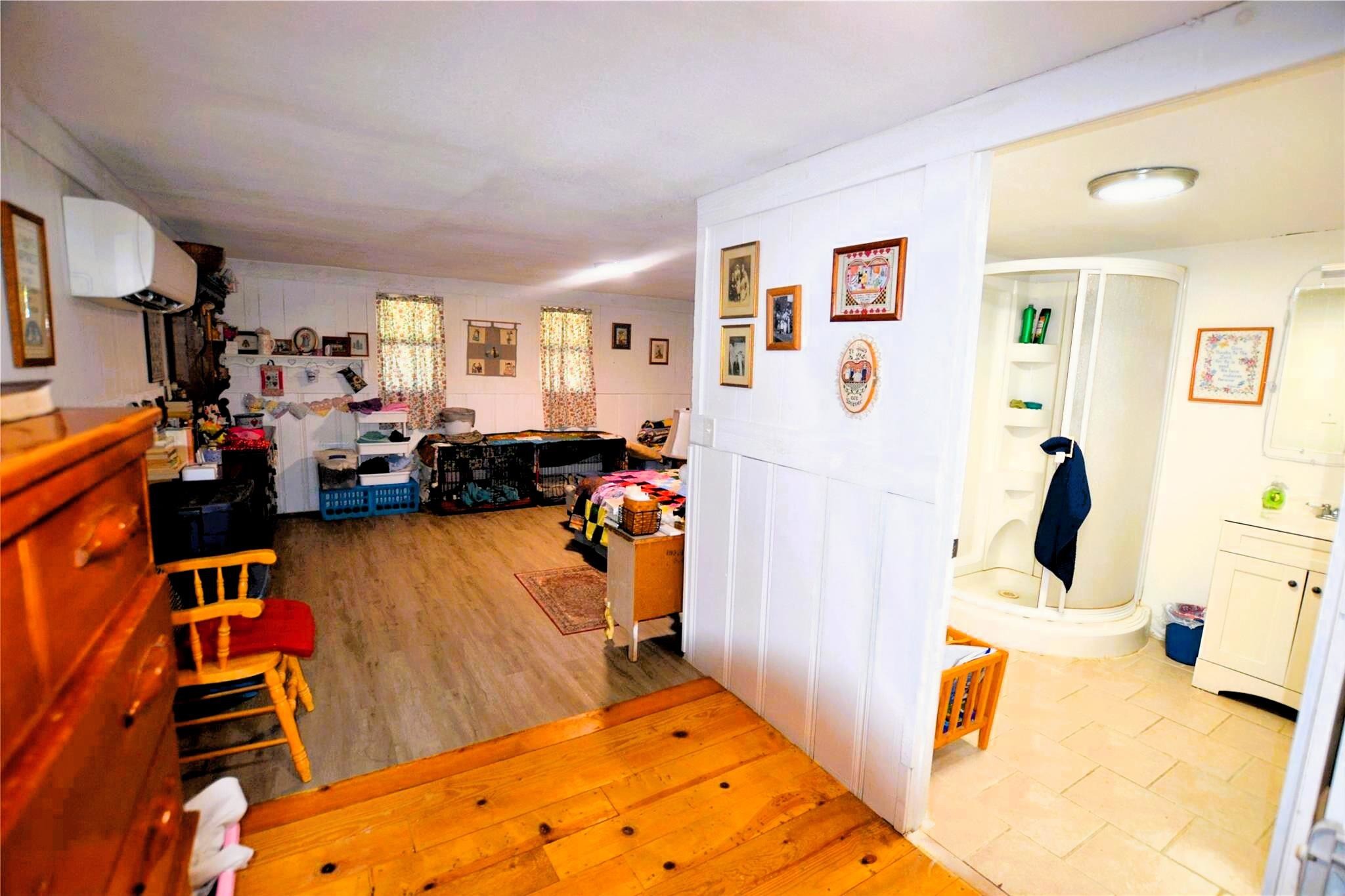 458 Rain Forest Road Onalaska, TX 77360 - Photo 20 of 35 a bed room with a bed and a couch