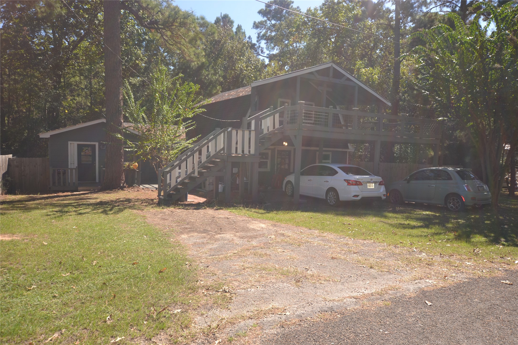458 Rain Forest Road Onalaska, TX 77360 - Photo 25 of 25 a backyard of a house with yard and outdoor seating