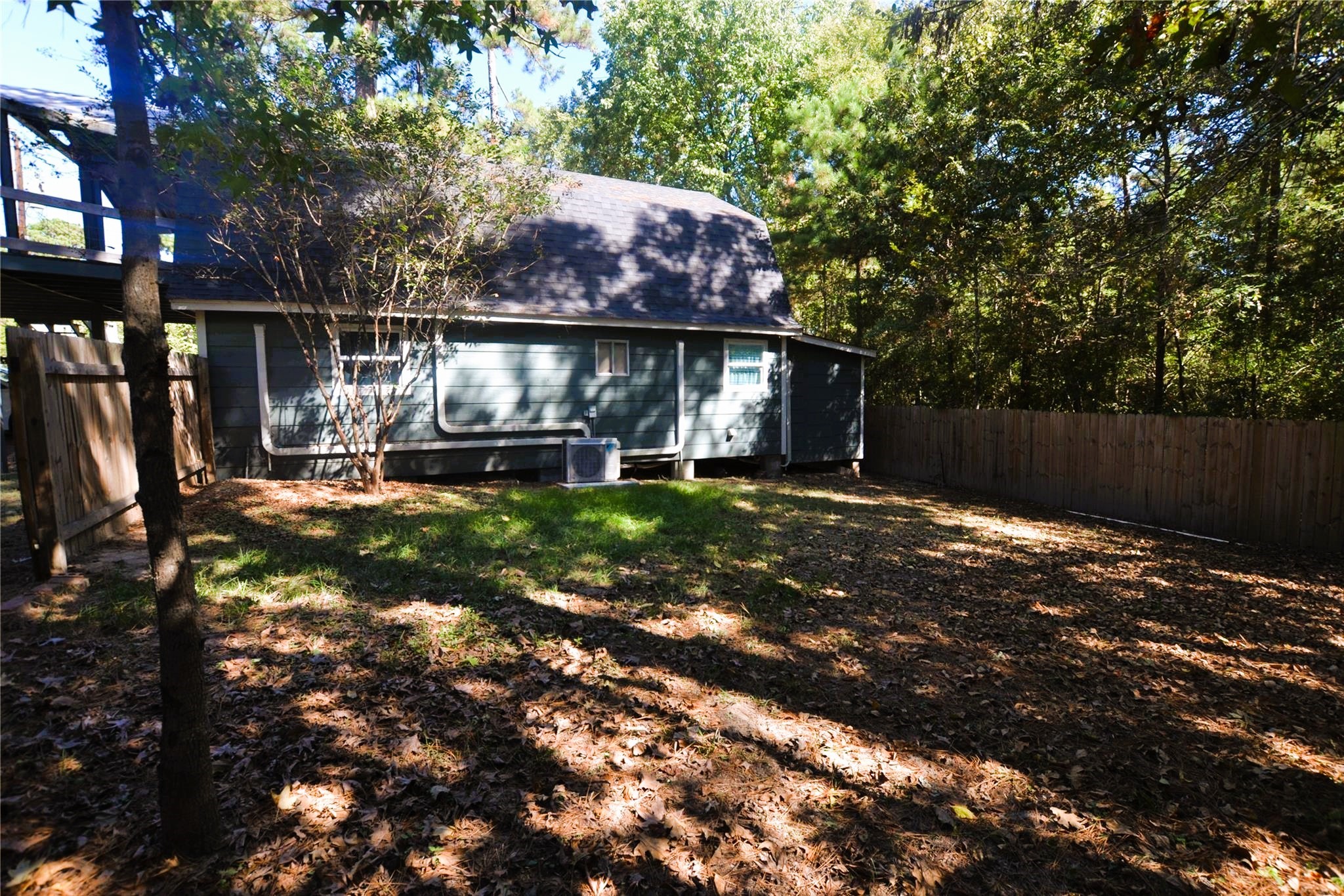 458 Rain Forest Road Onalaska, TX 77360 - Photo 26 of 35 a front view of a house with a yard