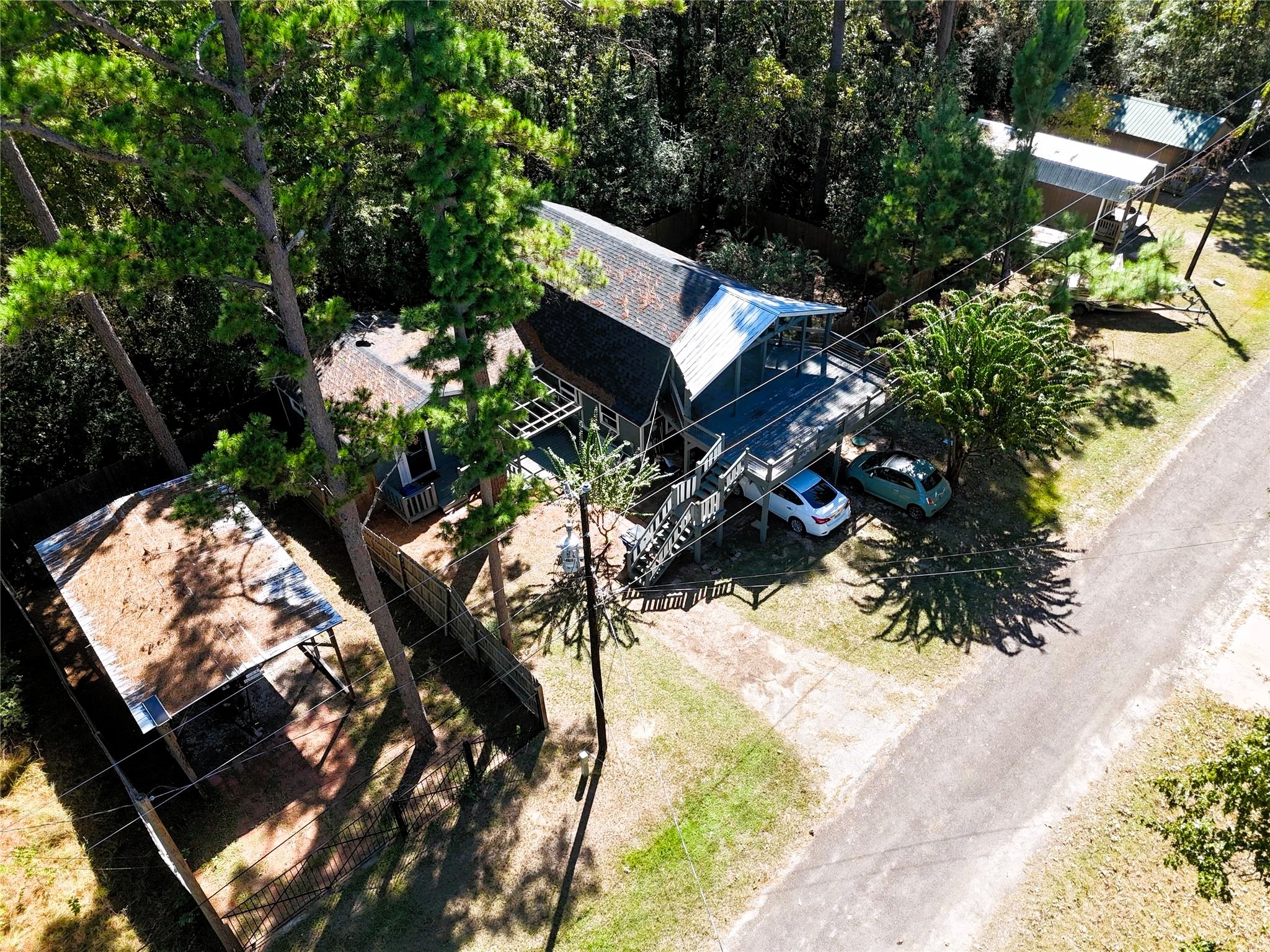 458 Rain Forest Road Onalaska, TX 77360 - Photo 28 of 35 a view of a tree with a yard