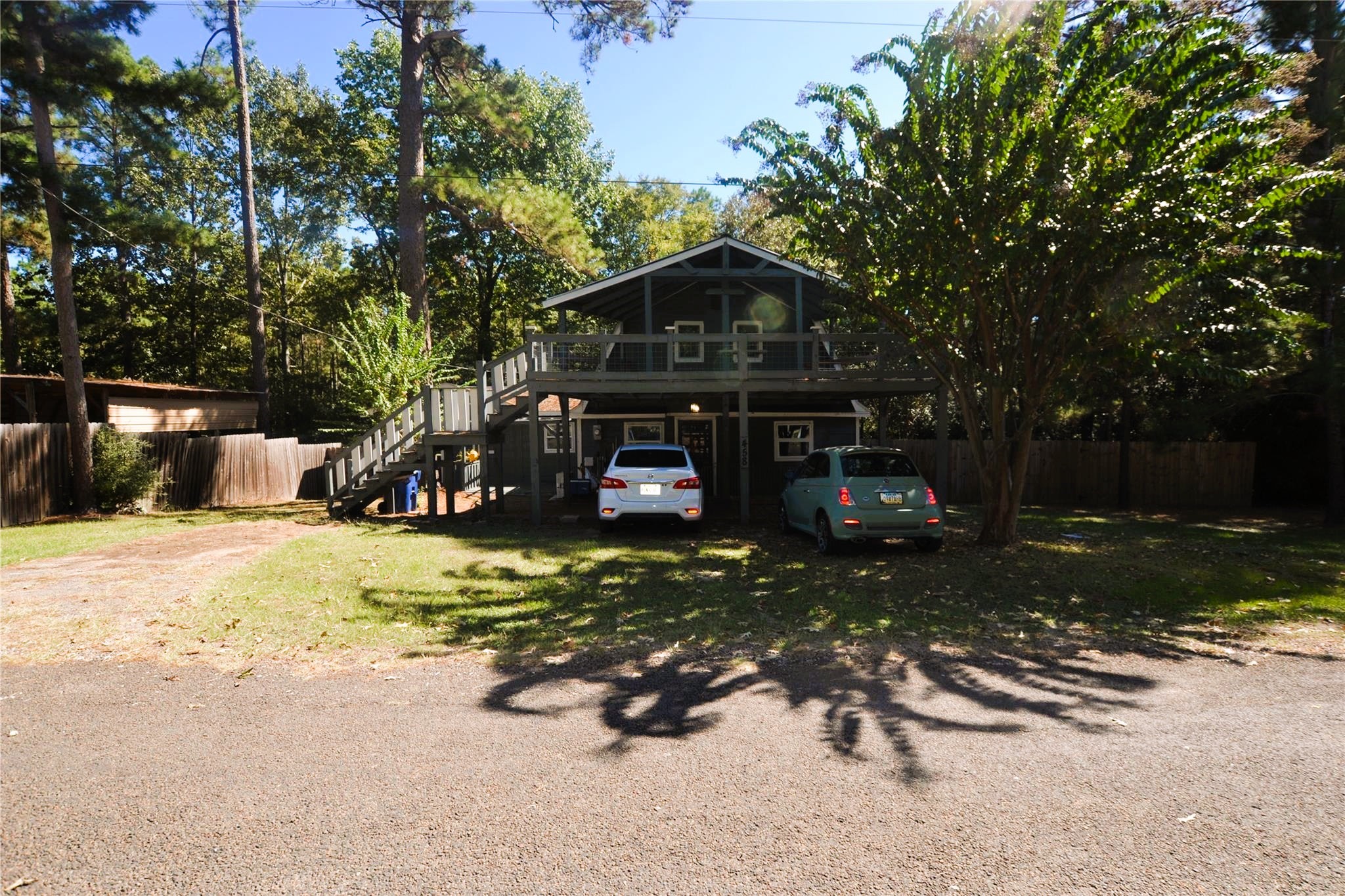 458 Rain Forest Road Onalaska, TX 77360 - Photo 33 of 35 a front view of a house with a yard