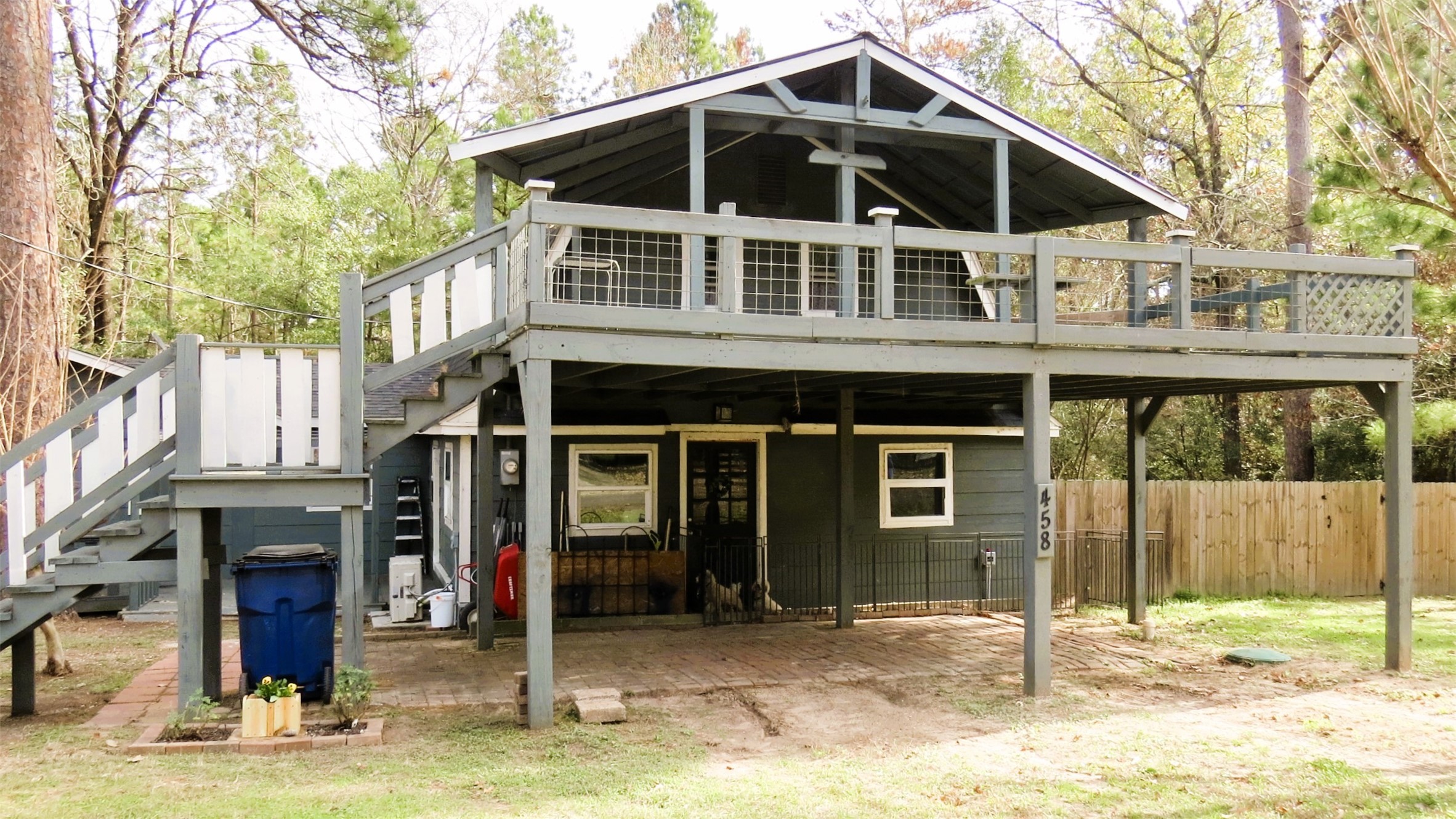458 Rain Forest Road Onalaska, TX 77360 - Photo 35 of 35 a front view of a house with a porch