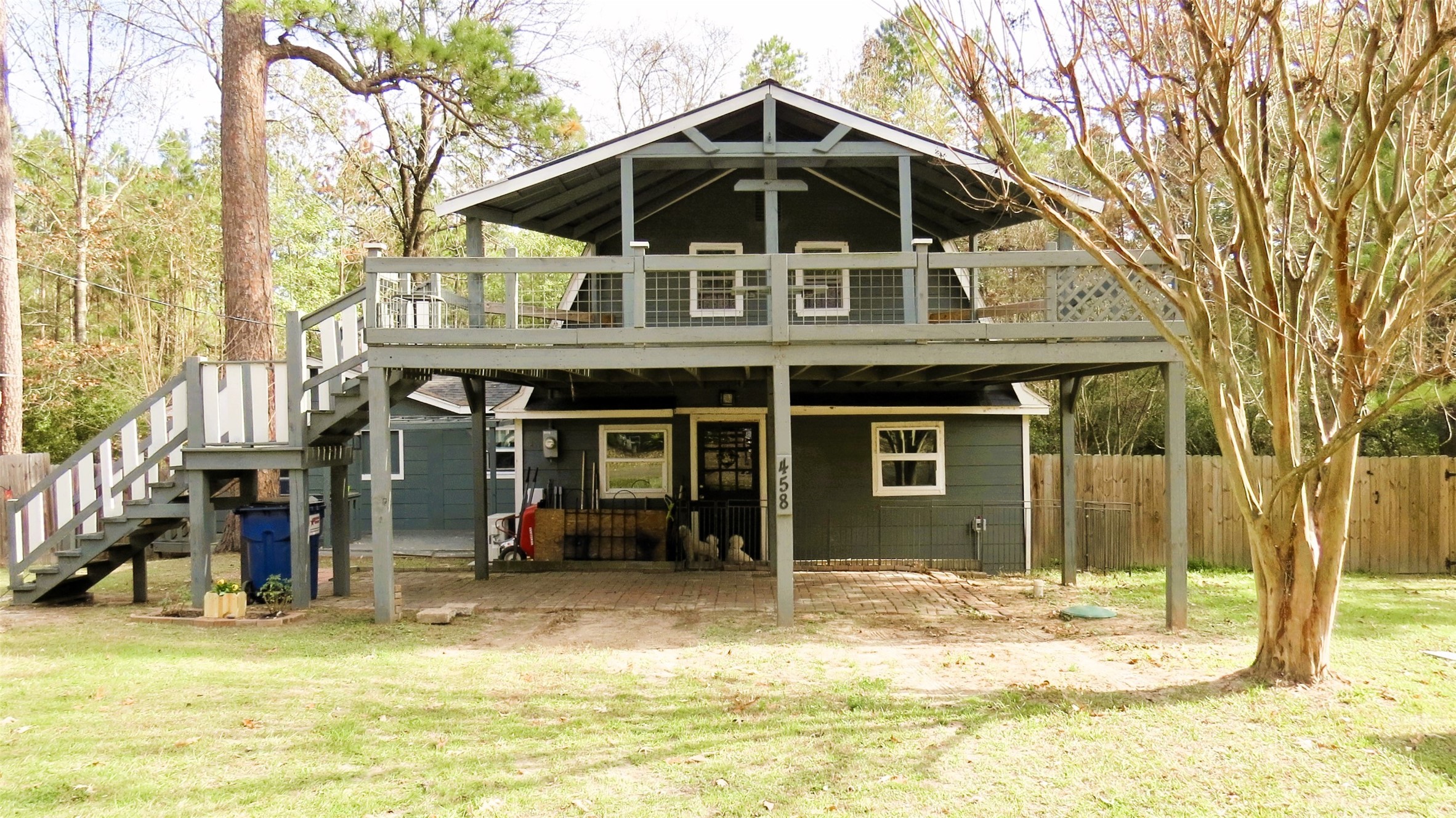 458 Rain Forest Road Onalaska, TX 77360 - Photo 4 of 35 a view of a house with a yard patio and fire pit