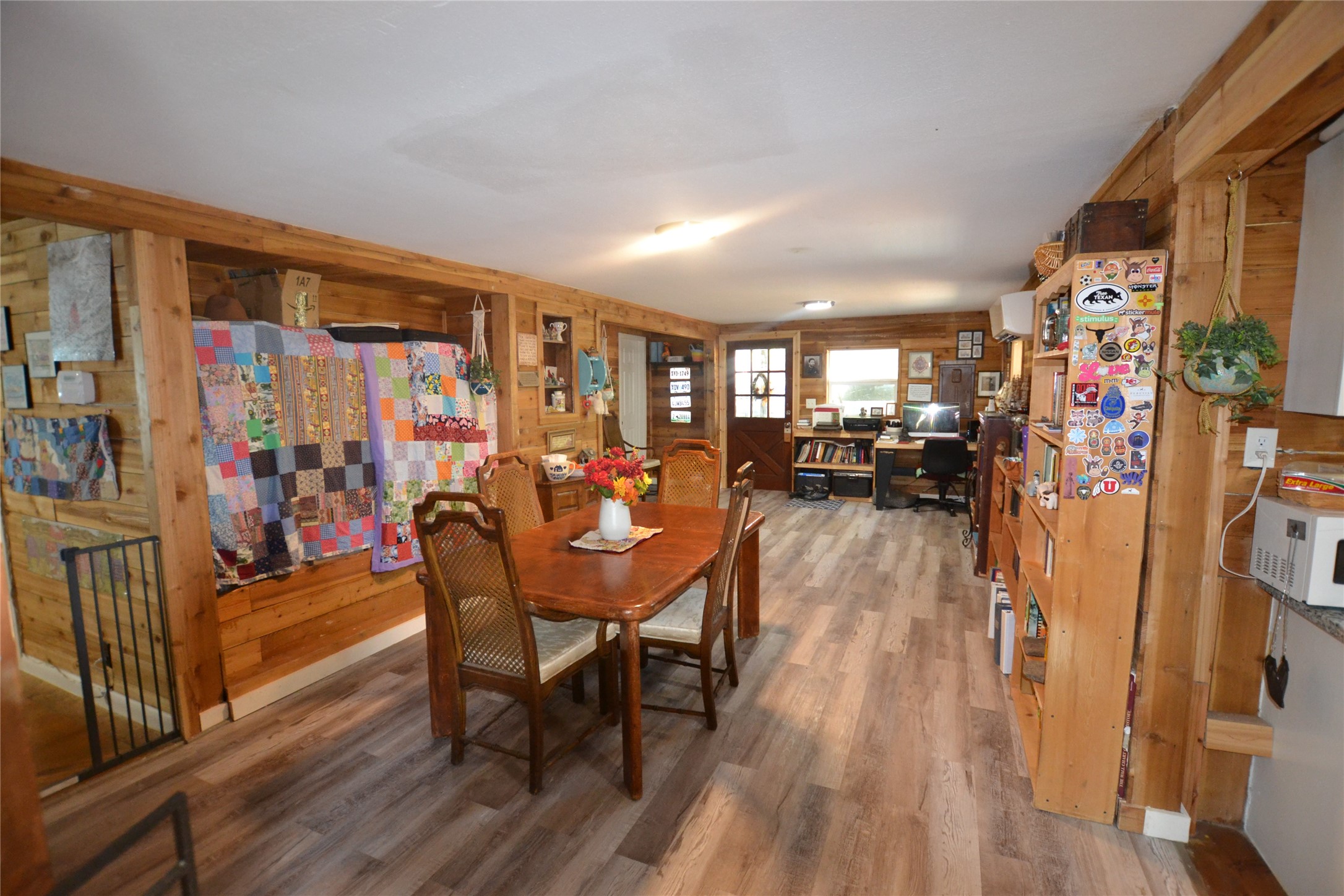 458 Rain Forest Road Onalaska, TX 77360 - Photo 4 of 25 a dining room with furniture and wooden floor