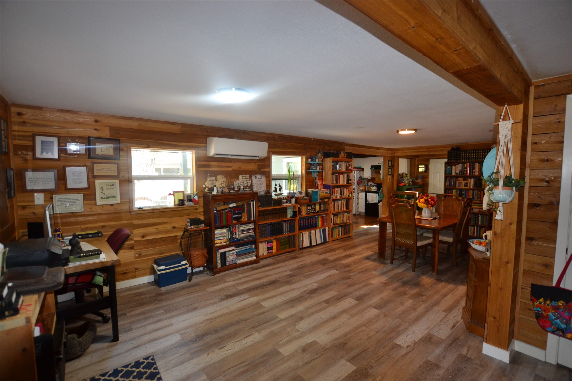 458 Rain Forest Road Onalaska, TX 77360 - Photo 5 of 25 a living room with lots of furniture a wooden floor and a large window