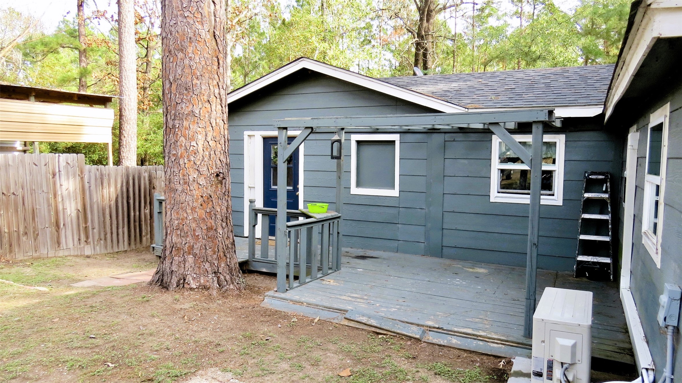 458 Rain Forest Road Onalaska, TX 77360 - Photo 6 of 35 a front view of a house with garden