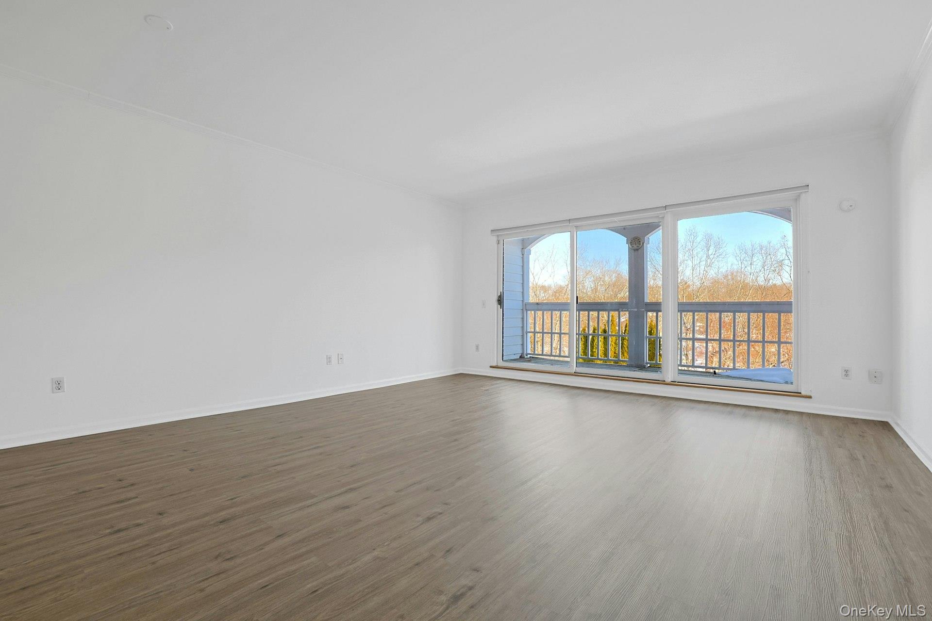333 North State Road, Unit 22 Briarcliff Manor, NY 10510 - Photo 7 of 23 Spacious living room with GSD to covered patio overlooking pool