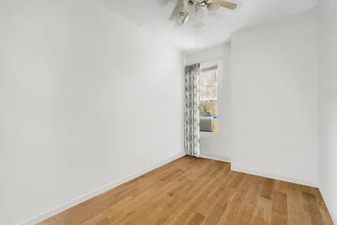 a view of a patio with a table and chairs