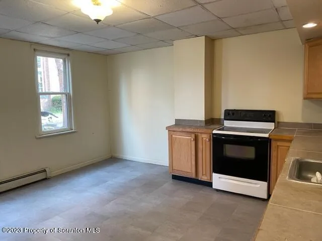 a kitchen with a stove and a microwave
