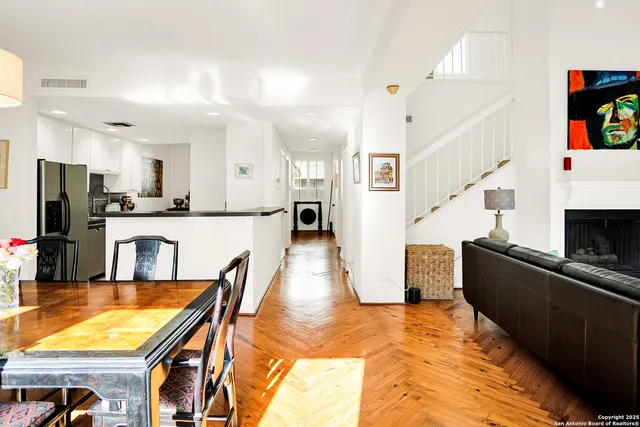 a kitchen with stainless steel appliances kitchen island granite countertop a refrigerator and microwave