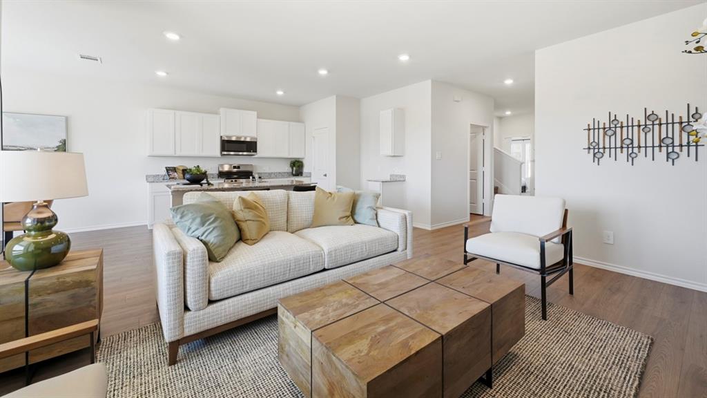1957 Freeman Street Tyler, TX 75704 - Photo 6 of 25 Open-concept living space featuring wood-finish flooring, recessed lighting, and crisp white wall finishes